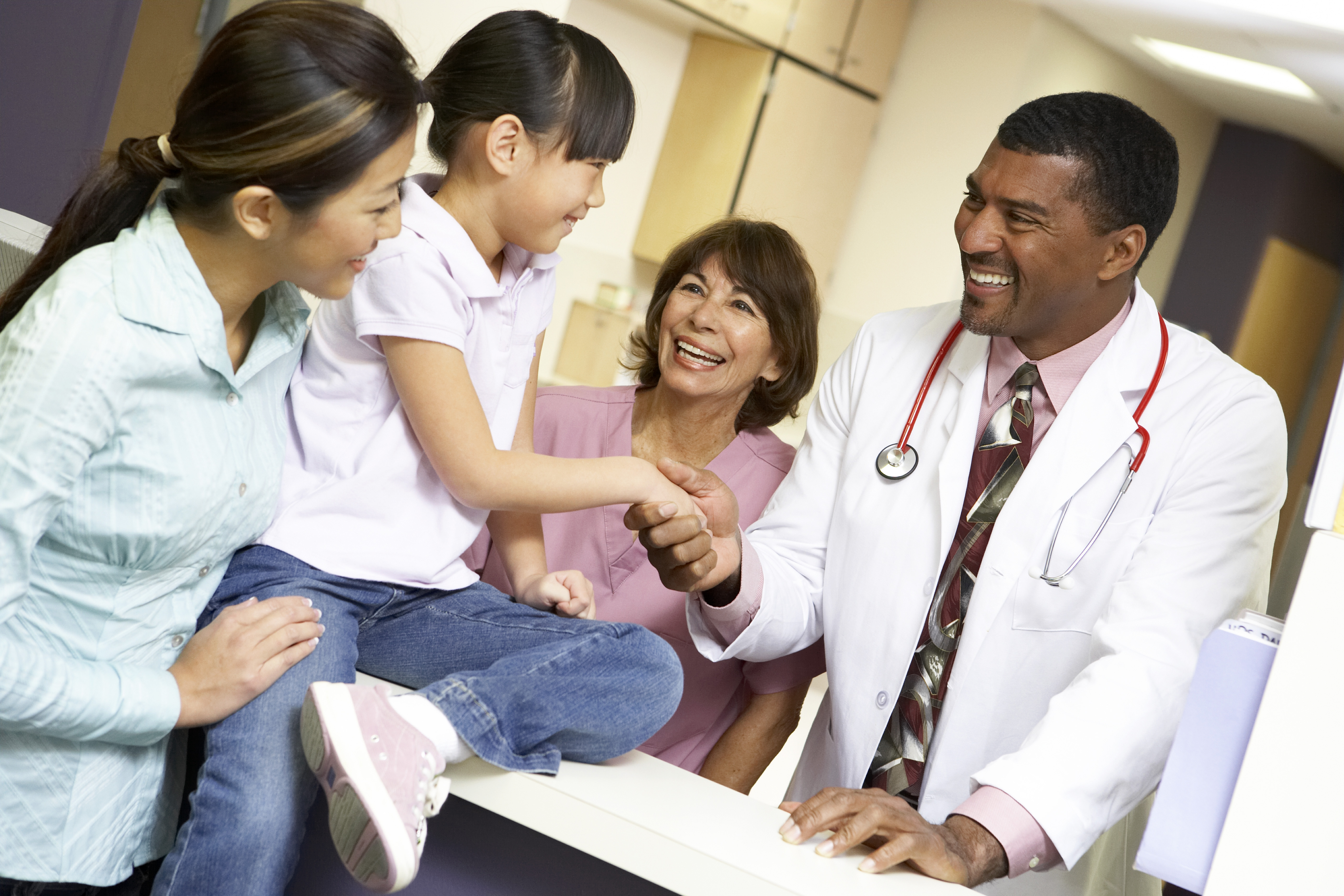 Doctors speaking, shaking hands